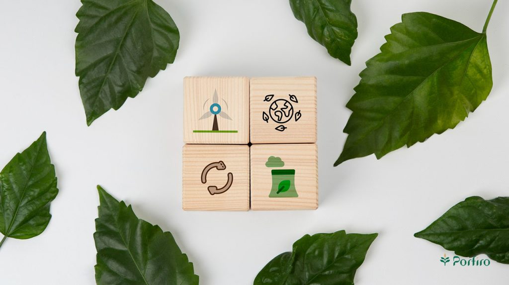 Factors indicating the superiority of organic food are carved on wooden blocks and surrounded by several green leaves.