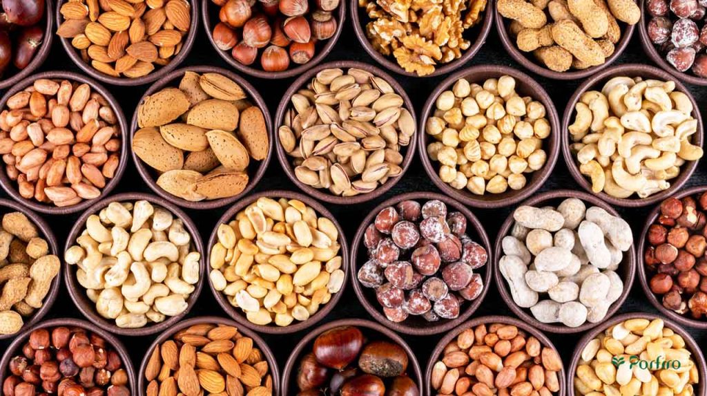 Different types of nuts in equal-sized bowls in the article Health benefits of nuts and seeds with an emphasis on pistachios
