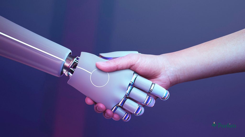 A human hand and a robot hand shaking hands.
