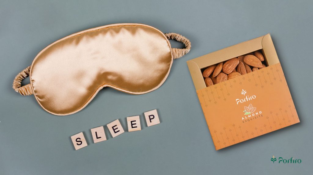 A pack of Porfiro almonds next to a sleep mask in the article Sleep health and diet; foods that improve sleep quality