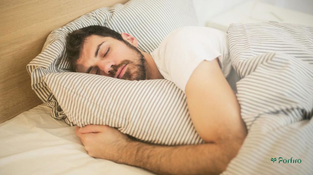 A man peacefully in his bed experiences quality sleep.