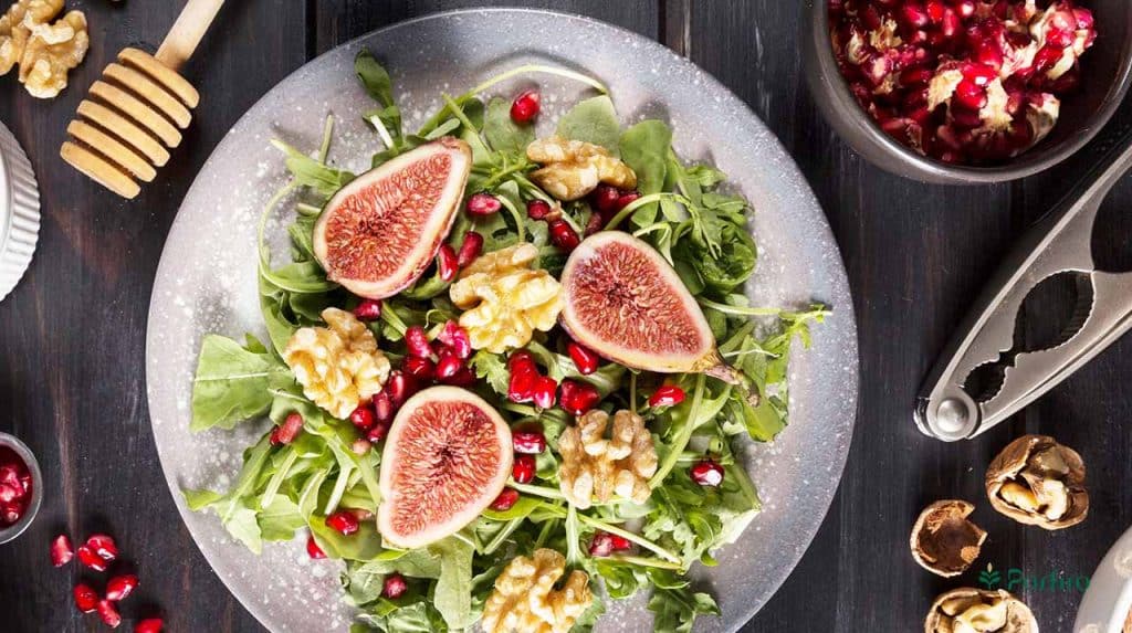 A fresh salad bowl containing slices of fresh figs to demonstrate ways to incorporate figs into your diet.