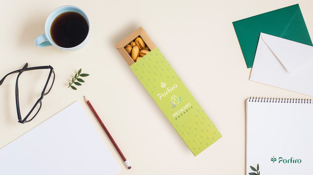 A package of Porfiro pistachios along with diary writing supplies as a useful method that combines diet and journaling
