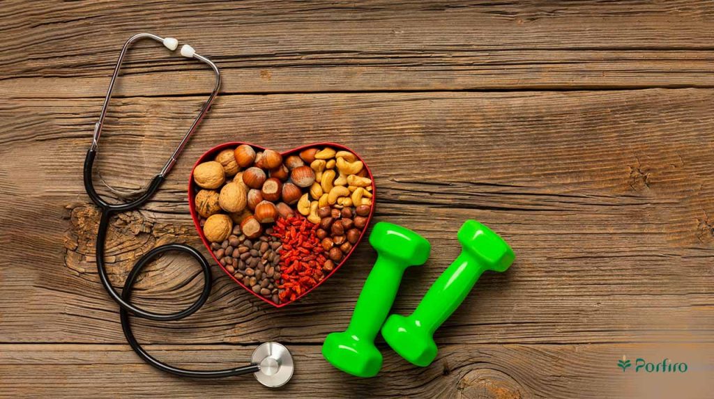 A heart-shaped container filled with a variety of nuts and seeds beneficial for a healthy heart for the article Heart Health and the Foods Suitable for It on Porfiro's blog